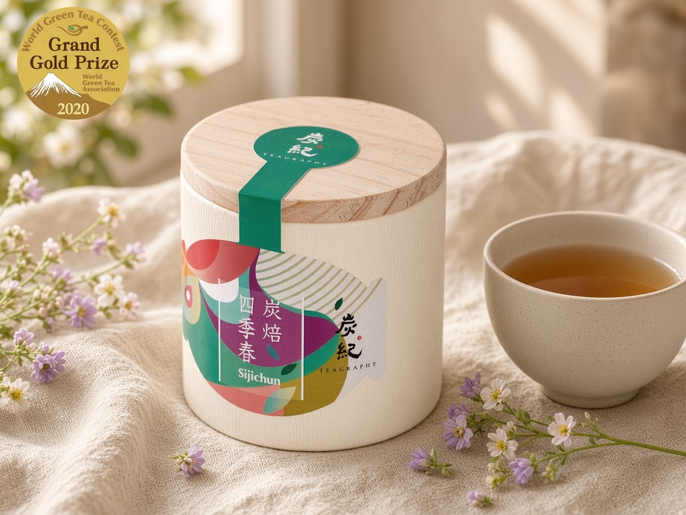 Teagraphy Si Ji Chun tea can and brewed tea in a bright setting