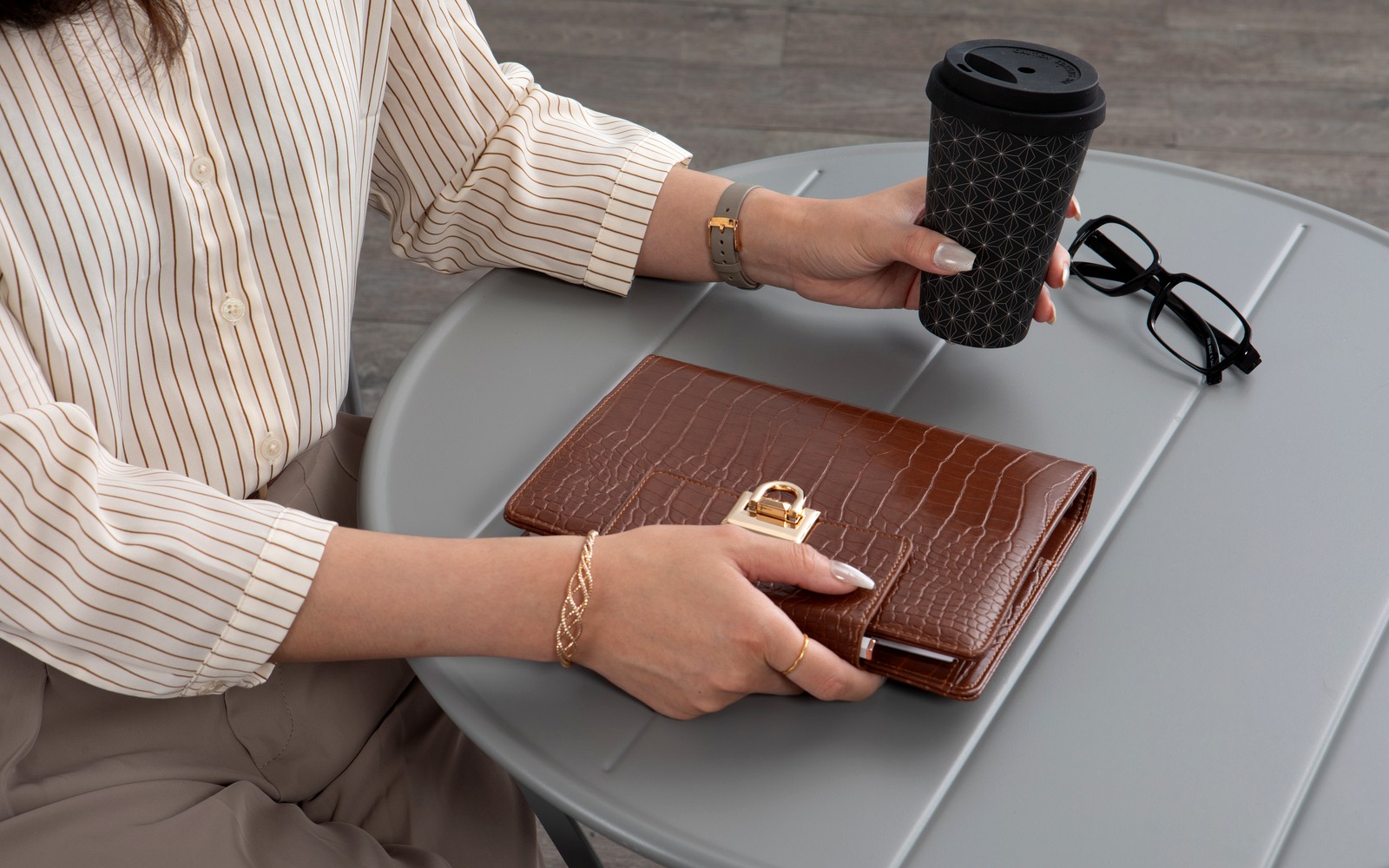 The Croco planner open to show refillable pages and embossed cover texture