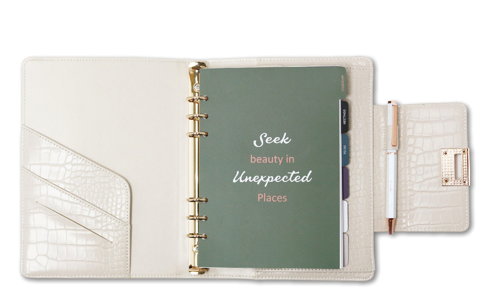 Open EGOSUNNY refillable planner on a desk with coffee and everyday essentials