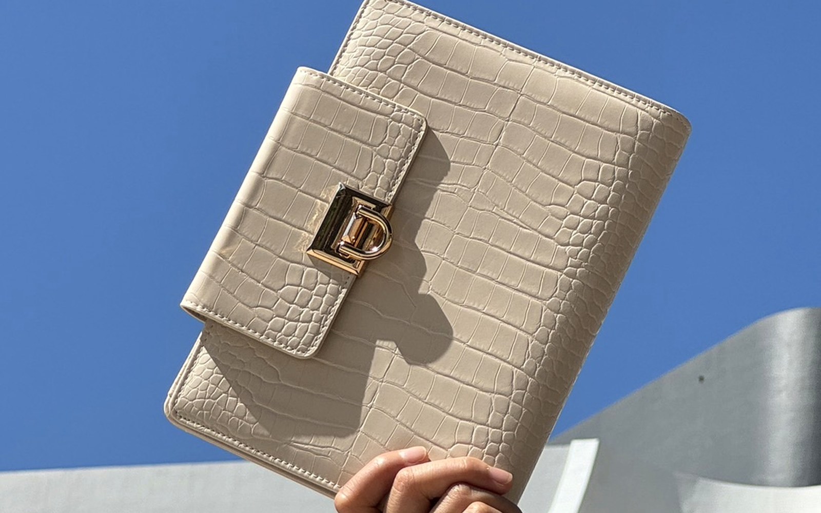 EGOSUNNY Croco planner in a chic lifestyle setting showing fashion-forward presence