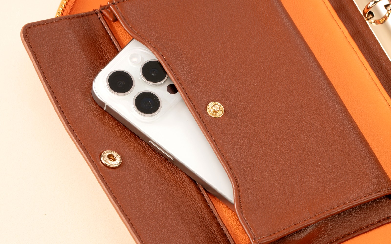 The Luna planner open with a phone tucked into its inner pocket