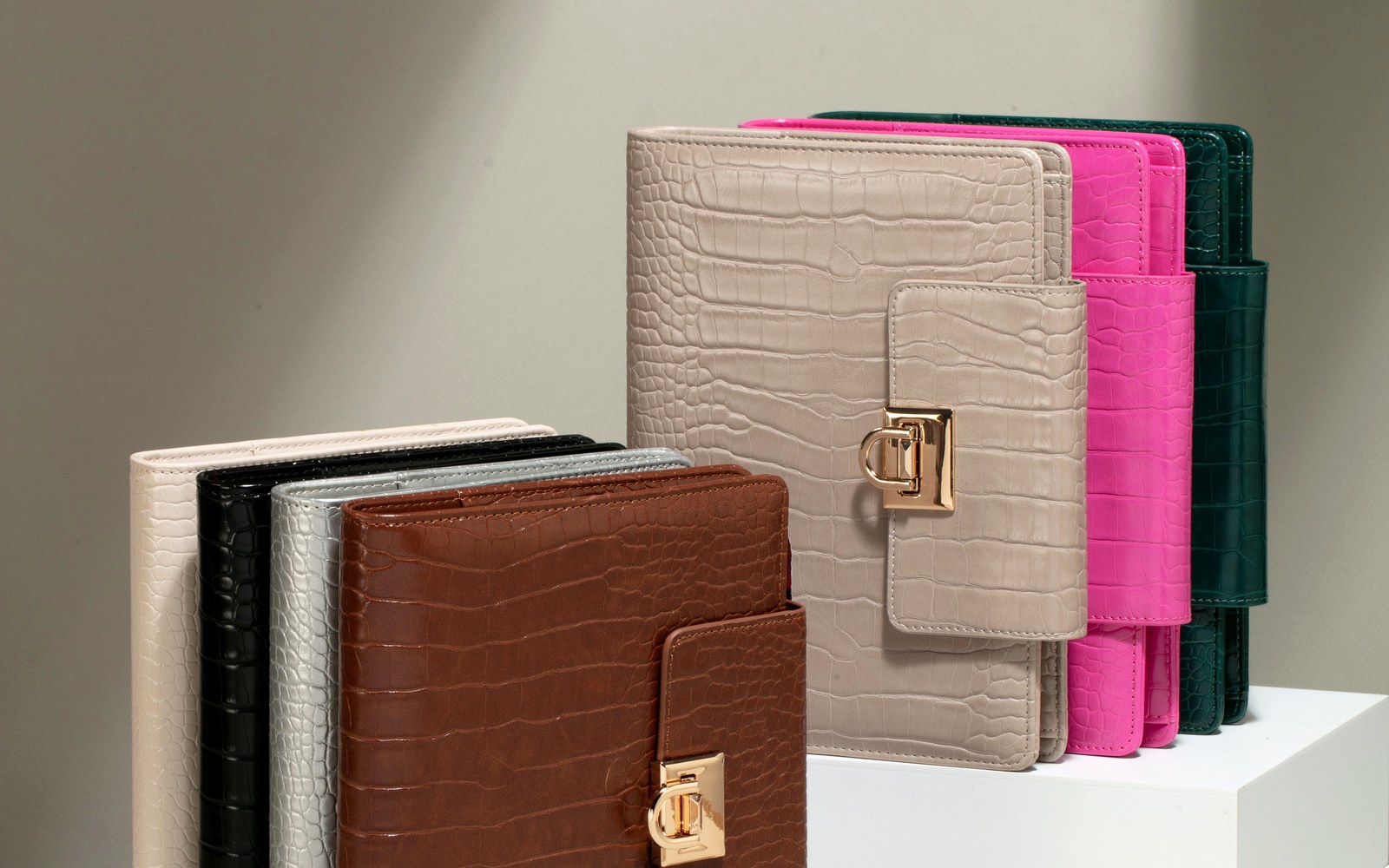 A stack of EGOSUNNY Croco planners ready for gifting