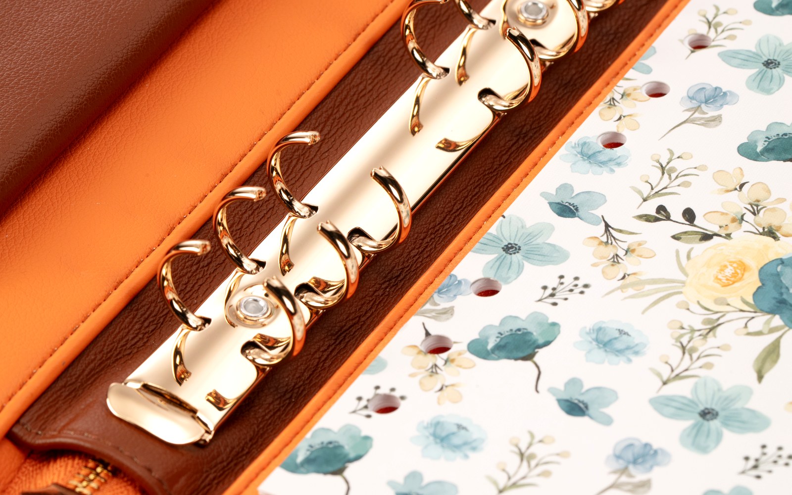 Floral insert and rings inside an open Luna planner