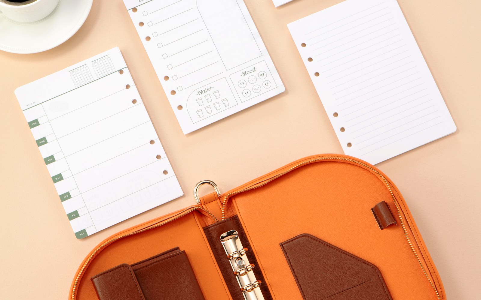 Planner pages spread around an open Luna planner