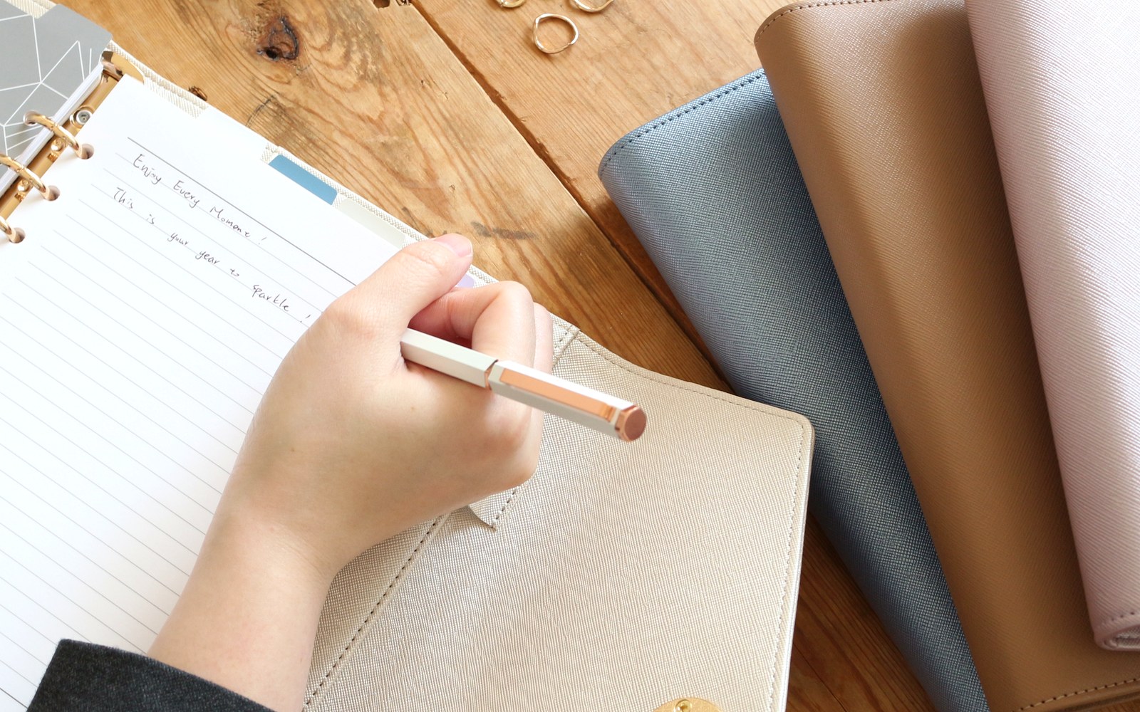 Writing on a lined page in an open EGOSUNNY planner