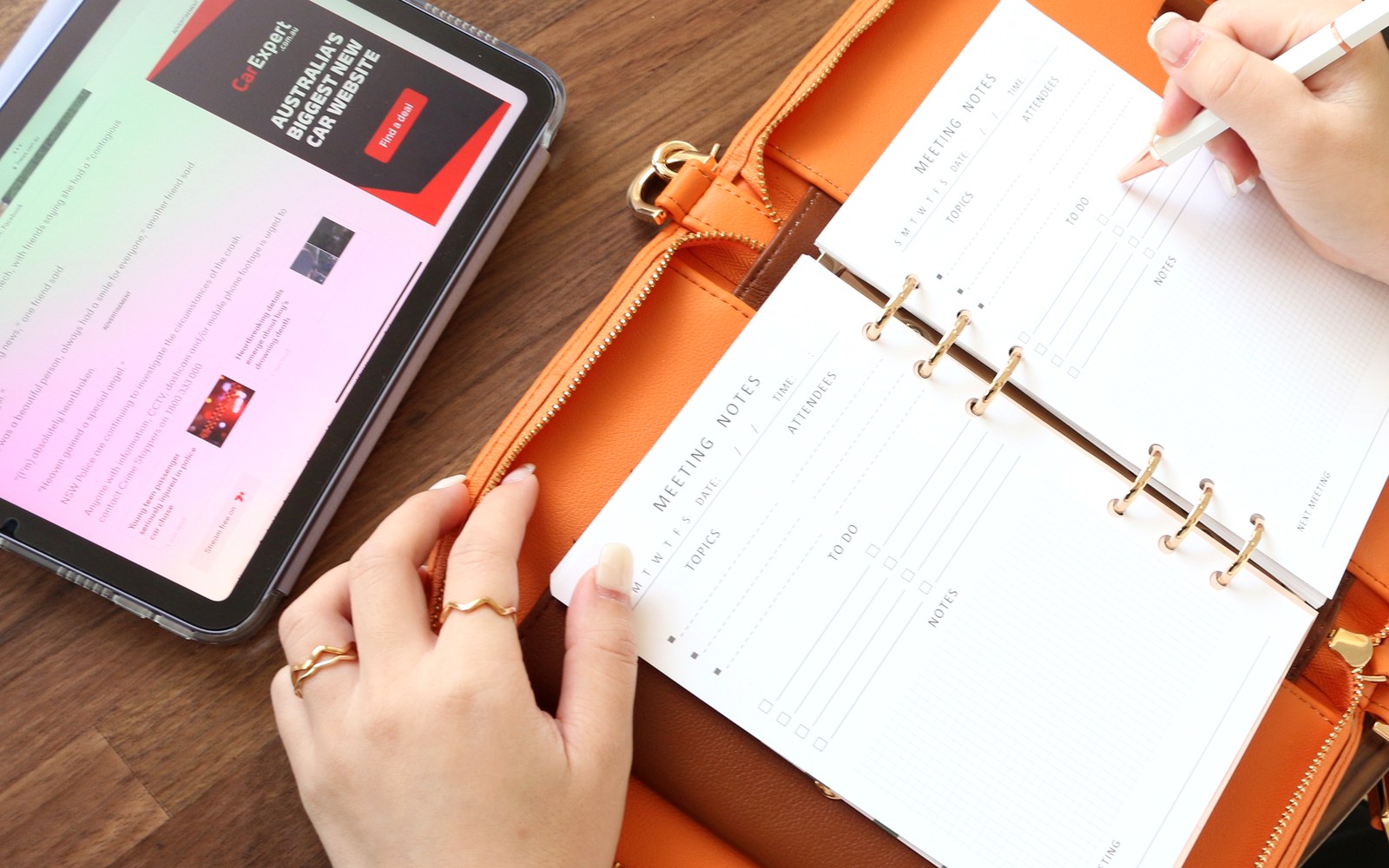 Orange EGOSUNNY Luna open on a desk beside a tablet