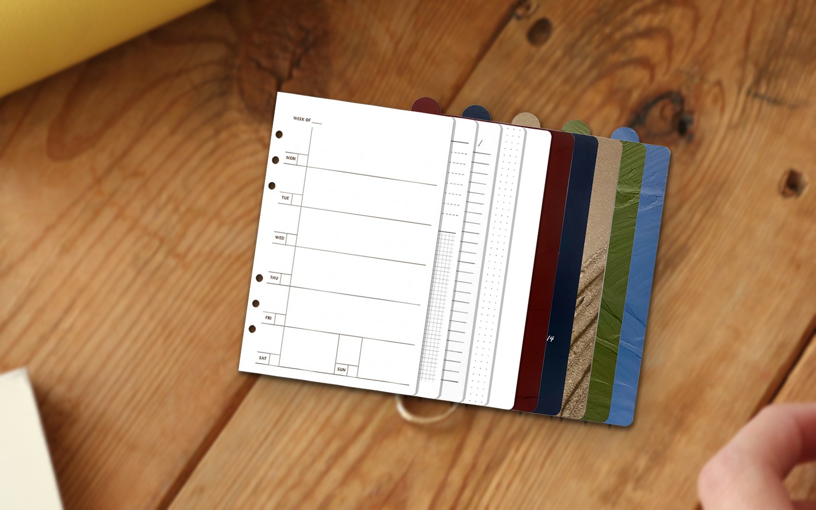 Refill pages fanned out on a wooden table