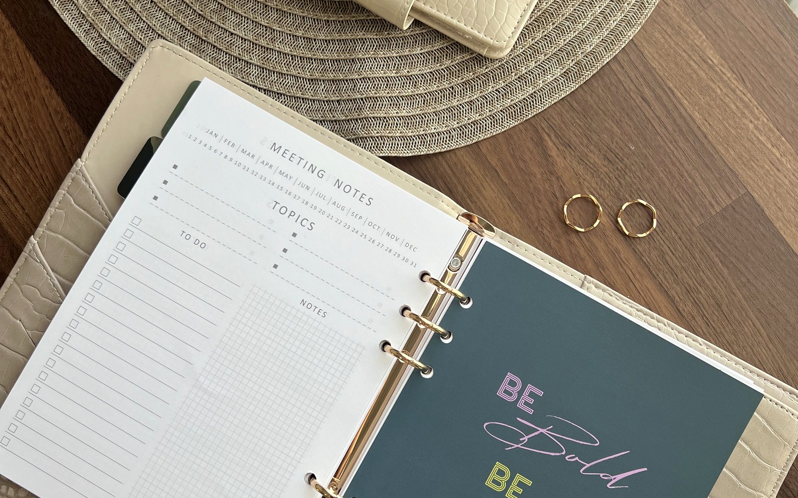 Open EGOSUNNY planner with notes and dividers on a wooden table