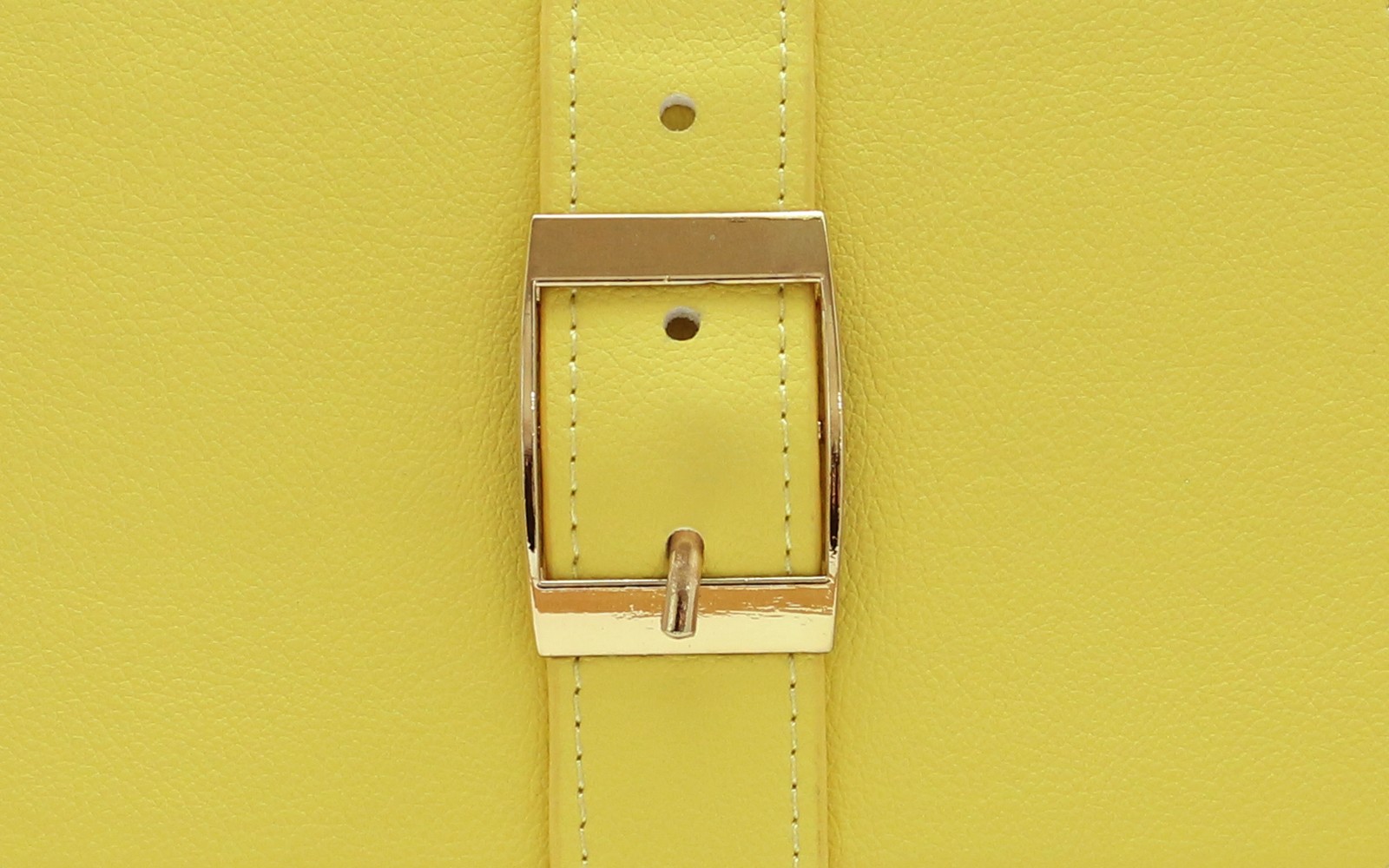 Close-up of the gold buckle on a yellow EGOSUNNY Belt planner