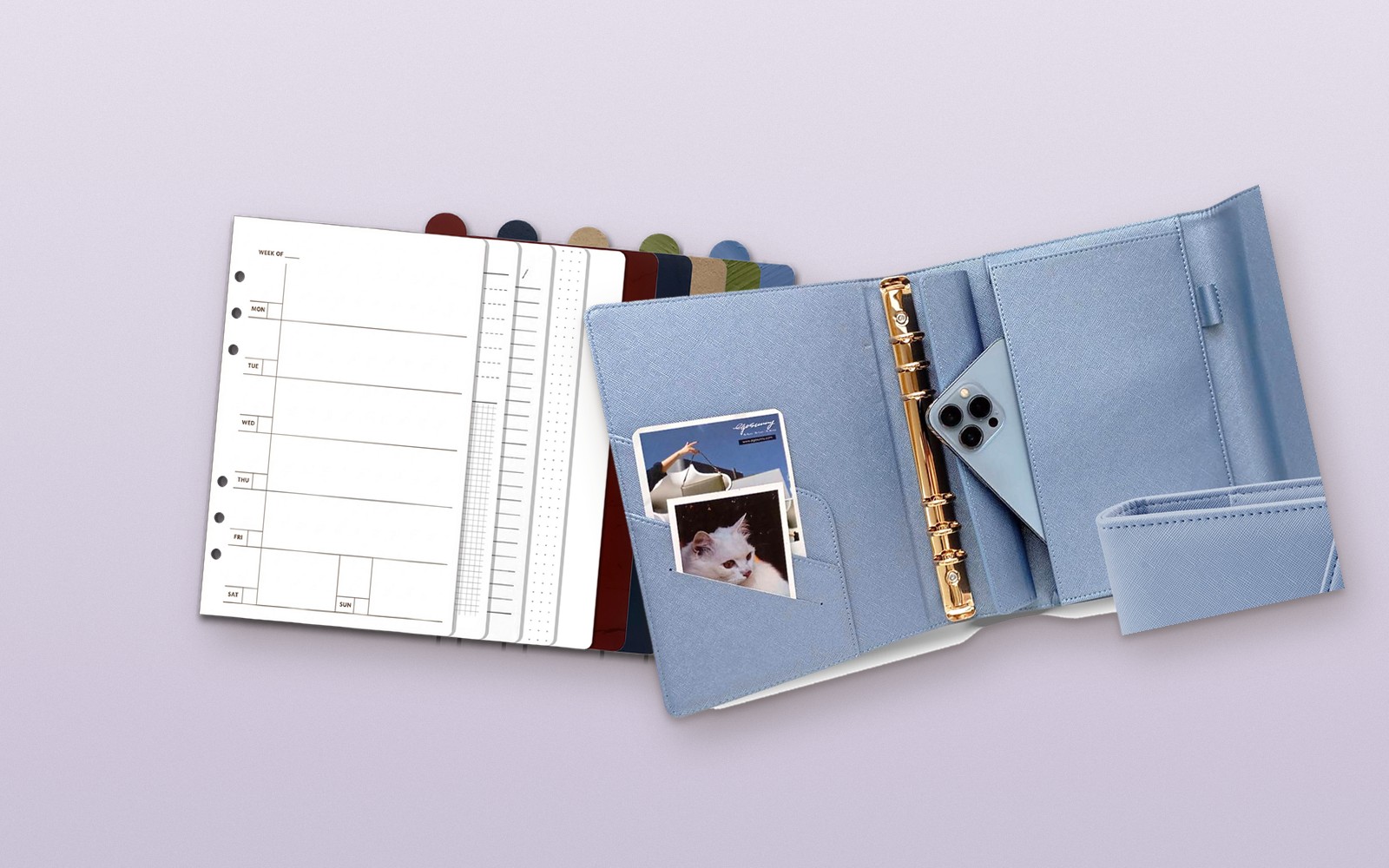 Refill pages beside an open blue EGOSUNNY L’Éclair planner