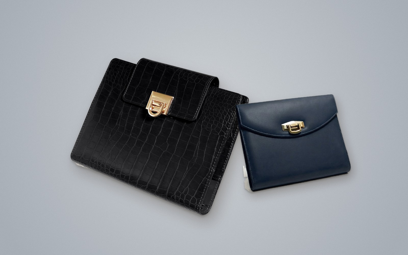 Black EGOSUNNY Croco beside a navy EGOSUNNY Terence
