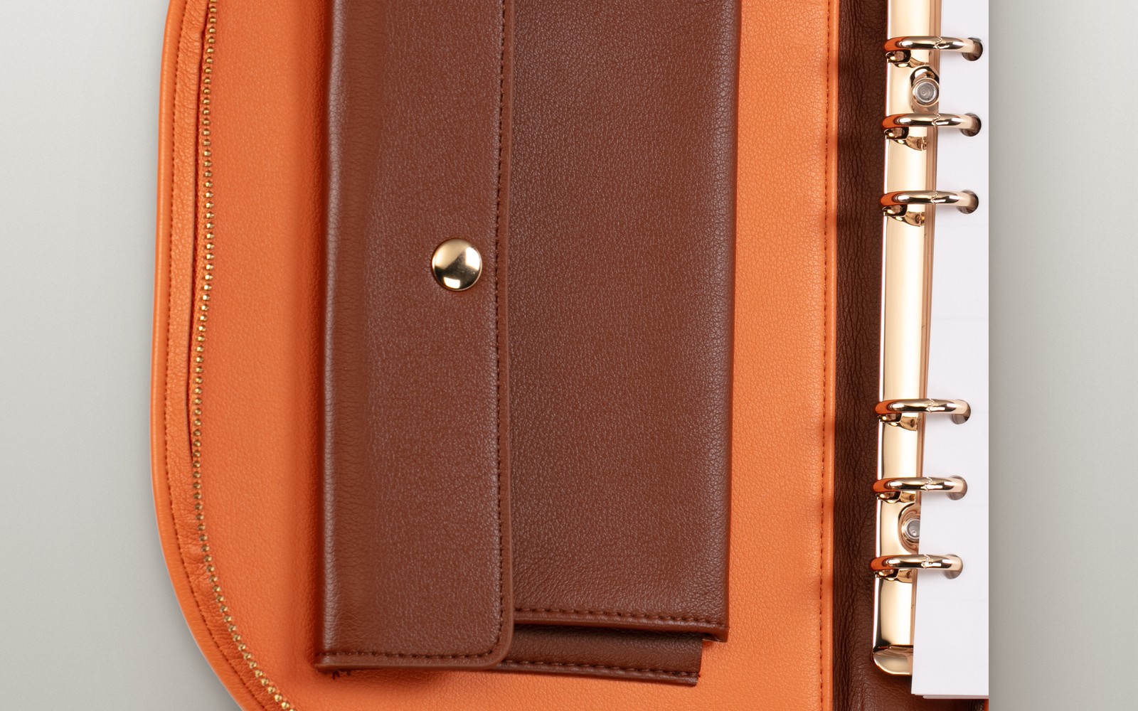 Close-up of the interior pockets of an orange EGOSUNNY Luna