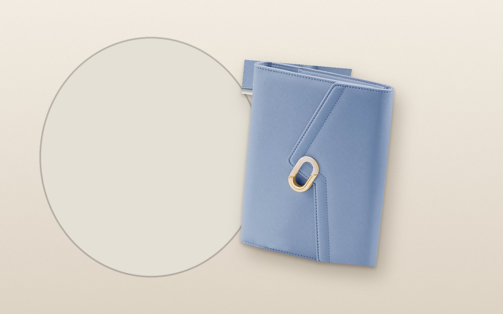 Blue EGOSUNNY L’Éclair planner on a cream circle background