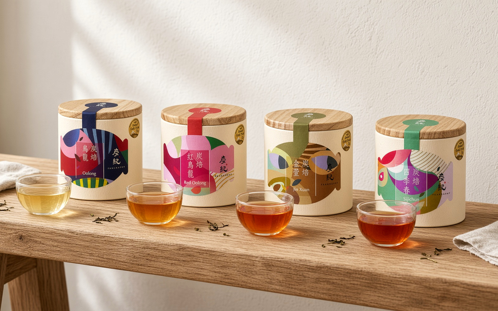 Three TEAGRAPHY oolong cans arranged from light to heavy oxidation