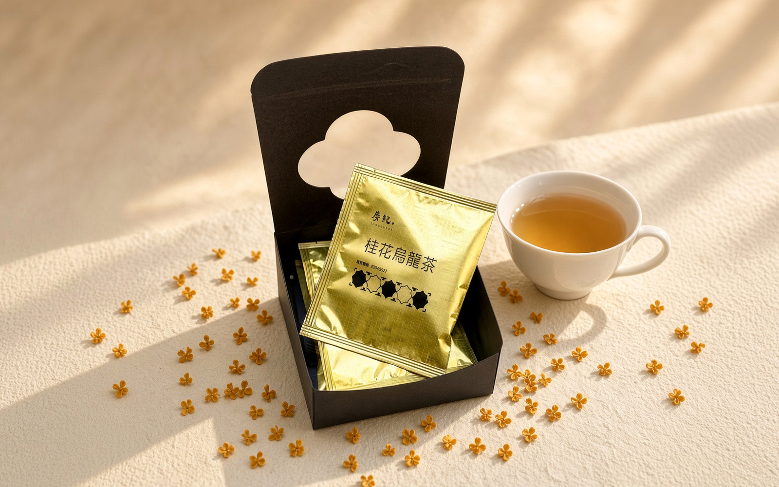 TEAGRAPHY Osmanthus Oolong gold sachets with a cup of golden tea