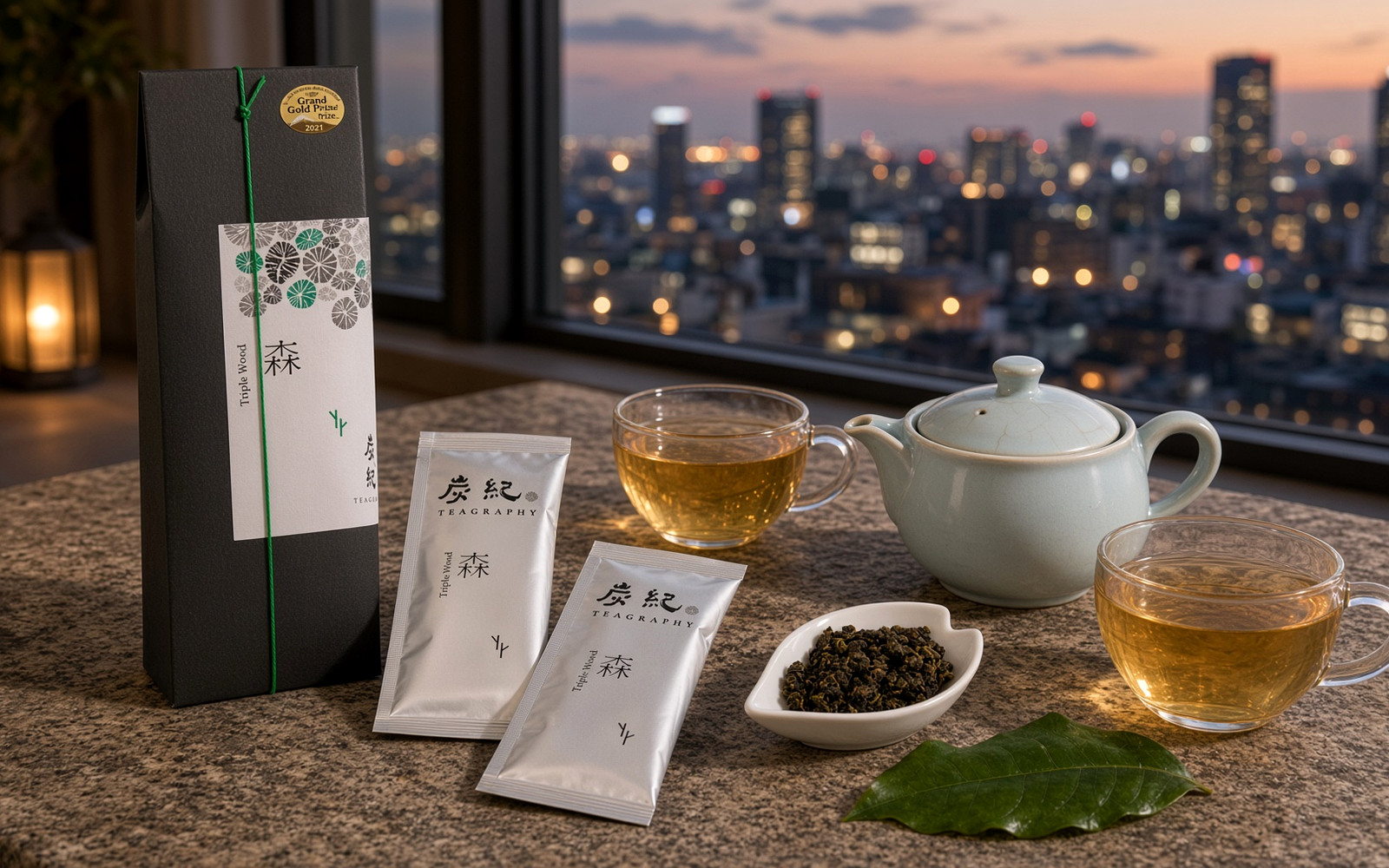 Unwrapped TEAGRAPHY oolong gift enjoyed with a small teapot and two cups