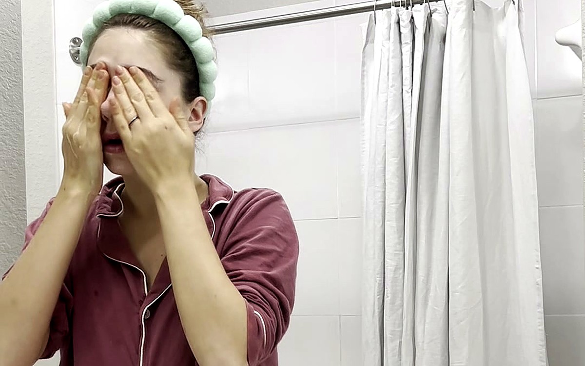 Woman rubbing her eyes after waking up