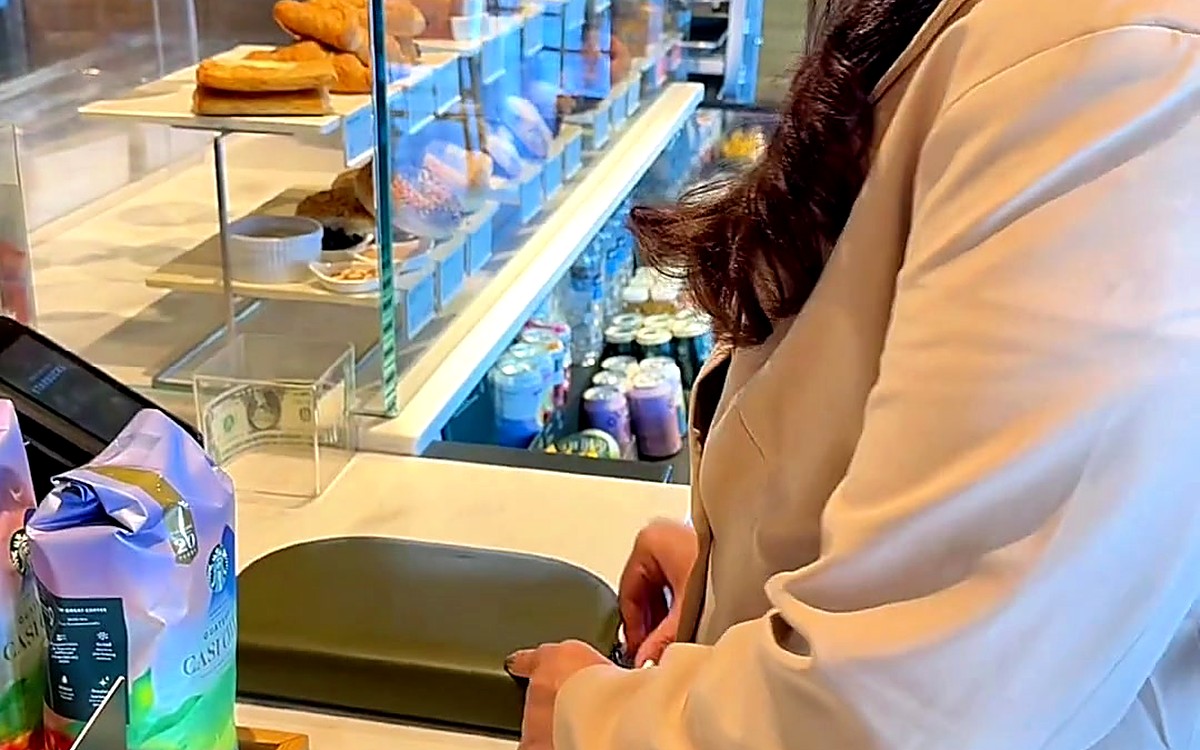 Woman at a café counter