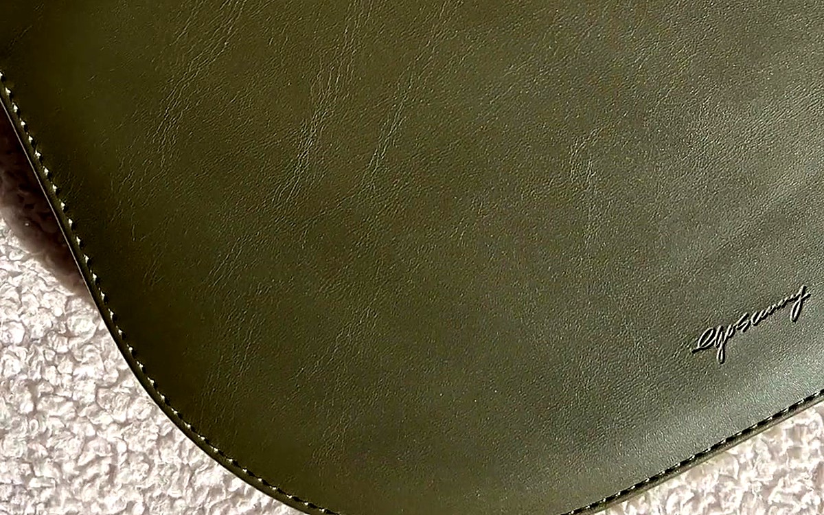 Close-up of a green EGOSUNNY cover with the brand name in the corner