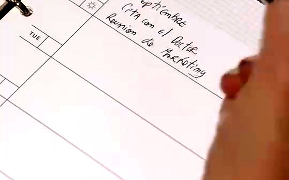 Handwritten list on a ring-bound planner page