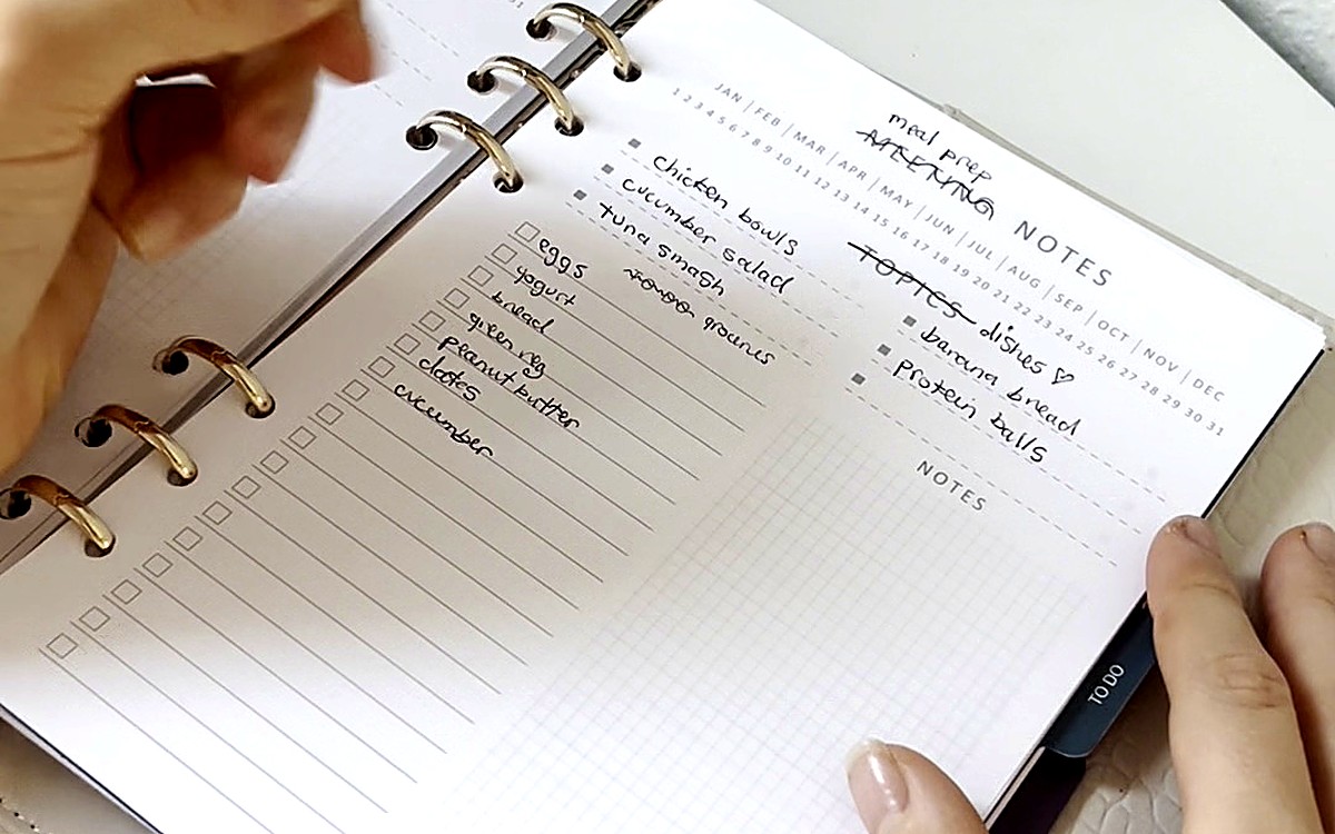 Hand writing on a ring-bound planner page